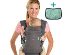 Smiling woman carrying a baby in a gray baby carrier, with a green drool pad alongside.