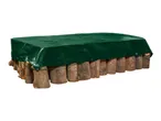 A rectangular raised garden bed made of logs, covered with a green tarp.
