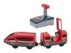 A red toy train with a driver figurine and a remote control.