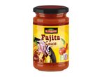 Jar of fajita sauce with a yellow label featuring tacos, vegetables, and text.