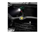 Cordless work light illuminating a car engine bay, hanging from the hood.