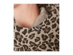 Close-up of a person wearing a leopard print jacket with a drawstring
