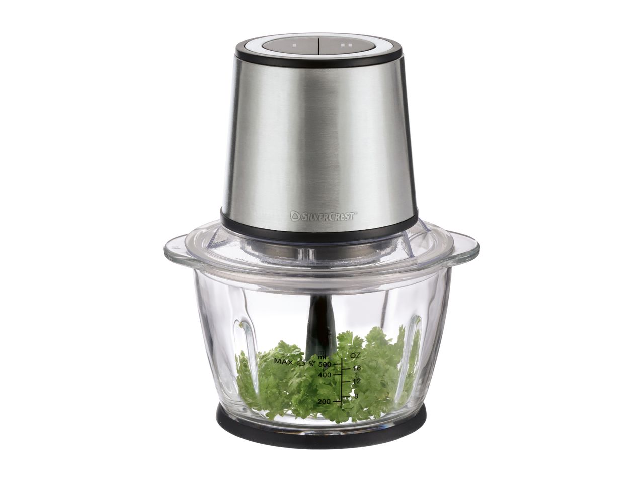Food chopper with a stainless steel motor unit and glass bowl containing parsley.