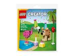Toy set featuring a flamingo and a dog wearing party hats, with a candle and lollipop, on a green and blue background.