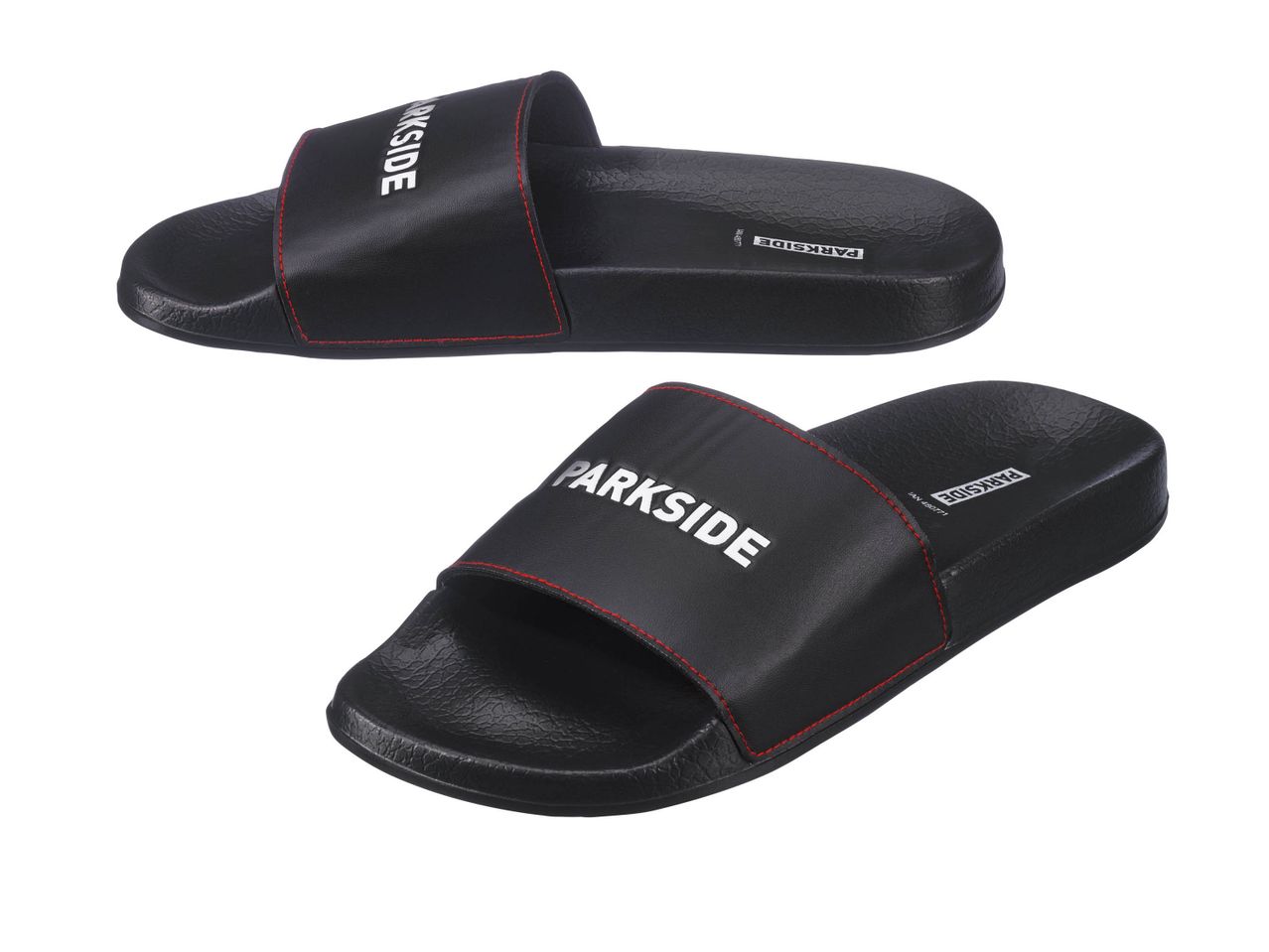 Two black Parkside slide sandals with red stitching.
