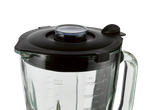 Apropiere a unui vas de blender cu capac negru și marcaje de măsurare.