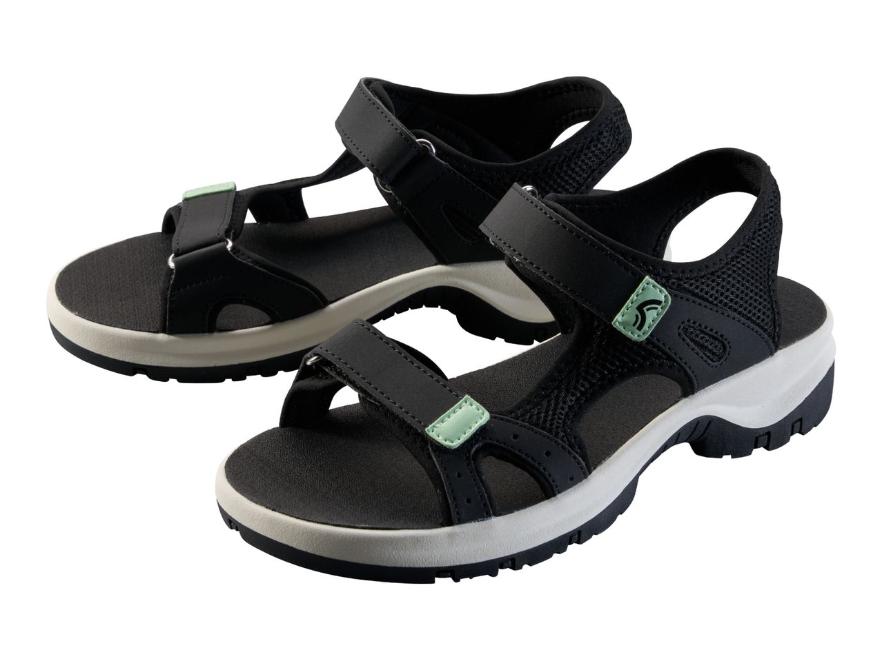 Pair of black and white sports sandals with light green accents