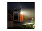 Portable solar power bank with a flashlight, set on a wooden surface under a starry night sky.