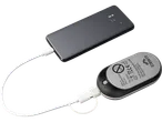 CRIVIT Rechargeable Hand Warmer charging a smartphone, with product details visible.