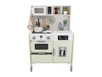 A wooden toy kitchen with a microwave, sink, oven, and refrigerator, featuring various accessories.