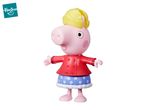 Peppa Pig toy figure wearing a red coat and blue polka dot skirt with a yellow hat.