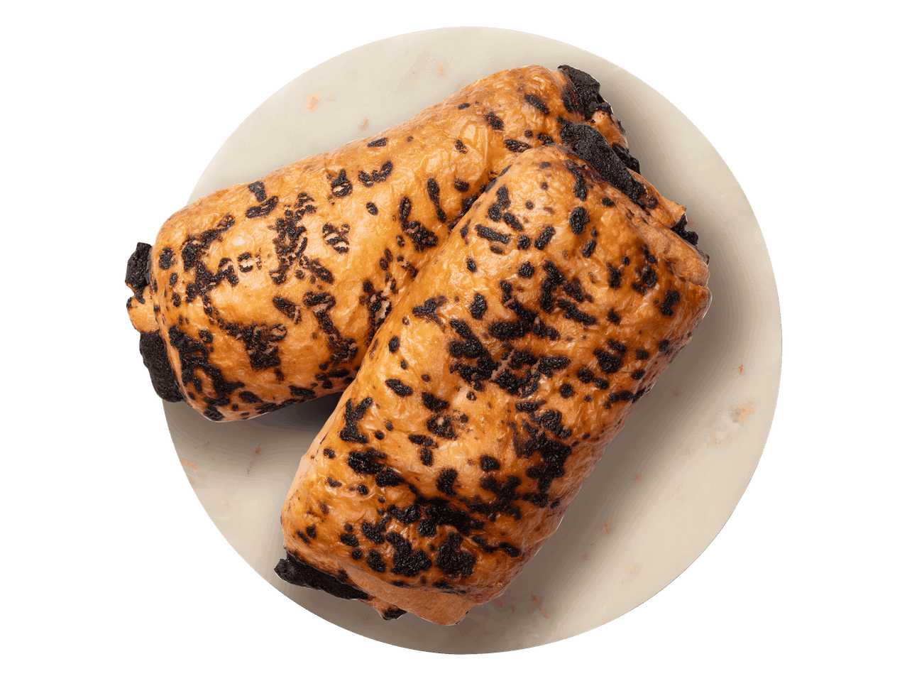 Két darab csokoládés párna egy kerek tálalón.