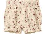 Cream-colored baby shorts with a delicate red floral pattern and ruffled leg openings.