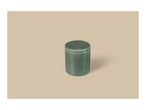 A cylindrical green ceramic jar with a lid, featuring a speckled texture, on a beige background.