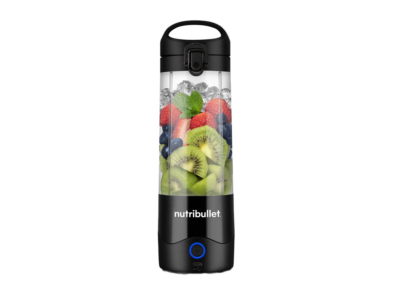 A black portable personal blender filled with fruit is ready to make a smoothie.