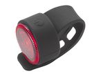 A black silicone bicycle rear light with a red lens.