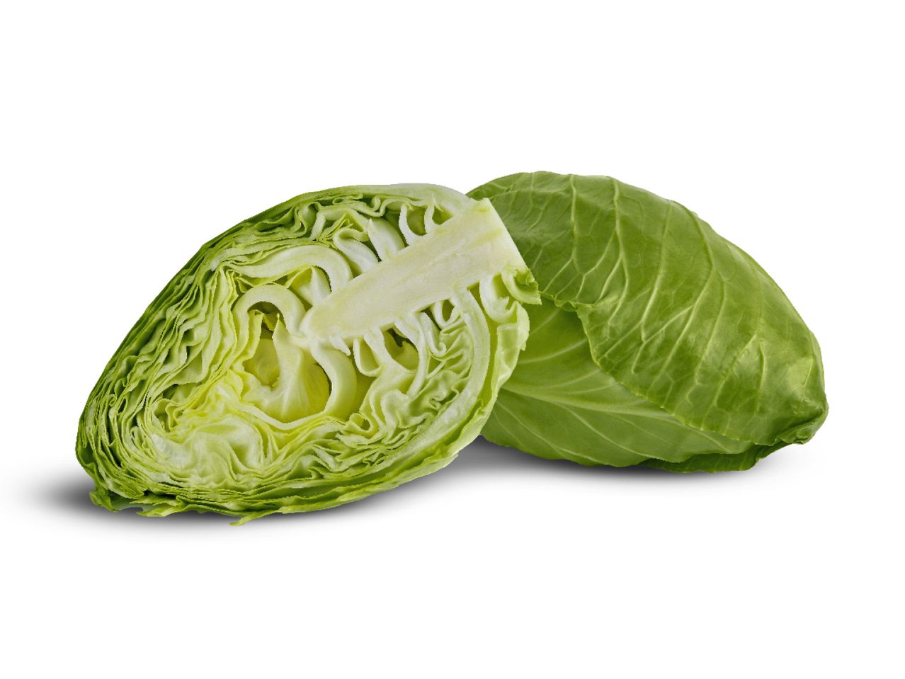 A whole green cabbage next to a half-cut green cabbage, showing its inner layers.