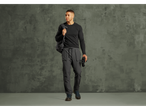 Man in black long-sleeve shirt, gray cargo pants, and hiking boots, holding binoculars.