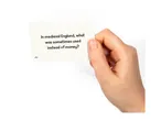 A hand holding a trivia card asking: 'In medieval England, what was sometimes used instead of money?'