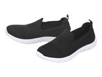 Pair of black slip-on sneakers with white soles
