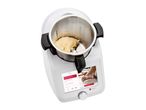 A Monsieur Cuisine Smart food processor with dough in the bowl, displaying kneading options on its screen.