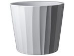 A white, fluted planter pot sits against a black background.