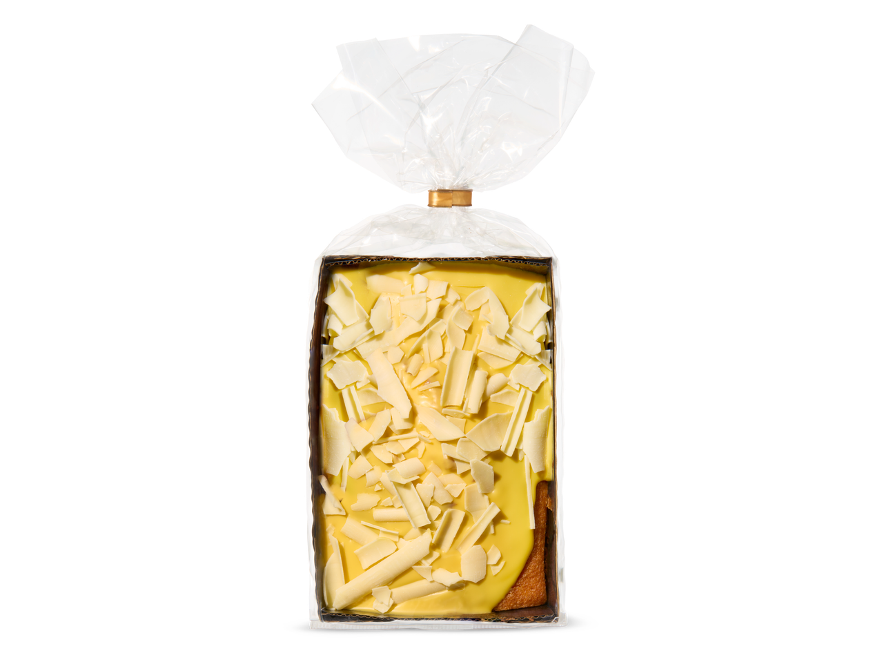 Een cake met gele glazuur en witte chocoladeschaafsel in een kartonnen doos met plastic verpakking.