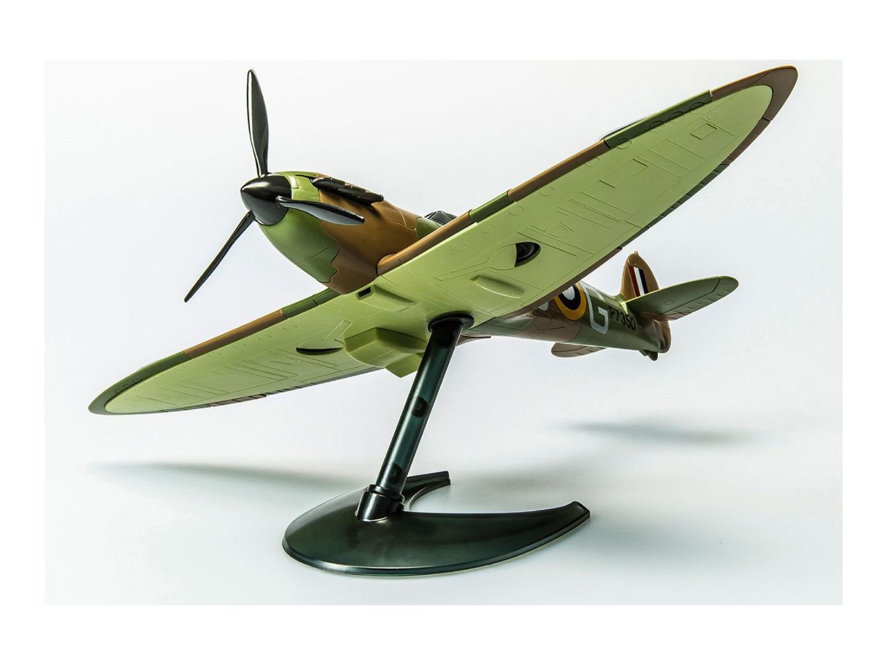 Model airplane, a Spitfire, in camouflage colors on a display stand.