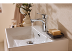 Livarno Mixer Tap Assortment with water running into a white sink, next to a bar of soap.