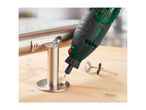 Rotary tool with a polishing attachment on a metal fixture, with wire brushes nearby.