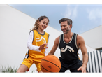 A father and daughter play basketball with a Crivit basketball.
