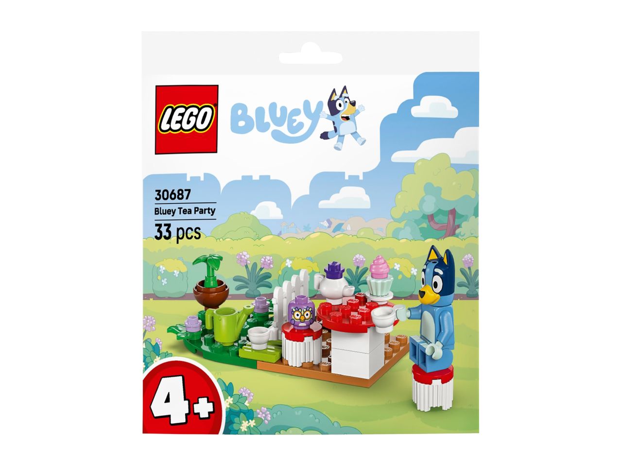 Toy tea party set with a blue dog figure, a table, and tea accessories.