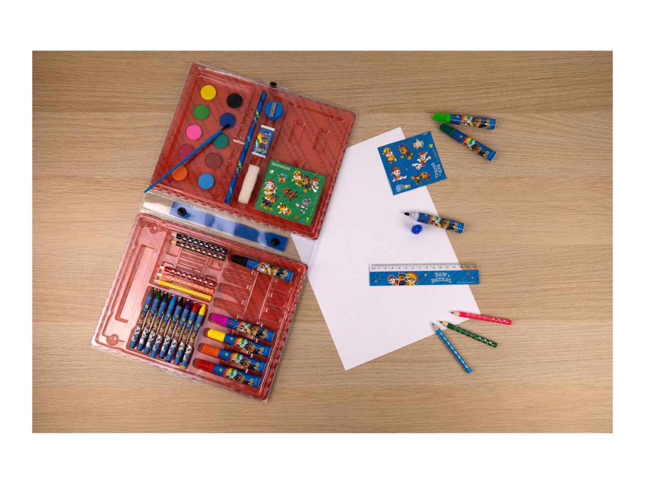 A children's art set with crayons, markers, and paper.
