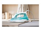 Steam iron with a turquoise water tank on an ironing board, with steam rising.