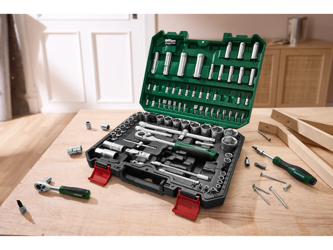 Parkside® tool set with wrenches and ratchet bits on a wooden table.