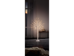 Illuminated birch tree with warm white LED lights in a cozy room setting.