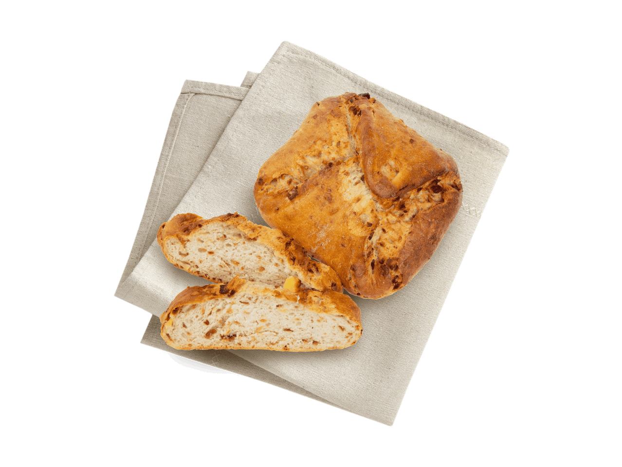 Ein Laib Brot und zwei Scheiben auf einem Leinentuch