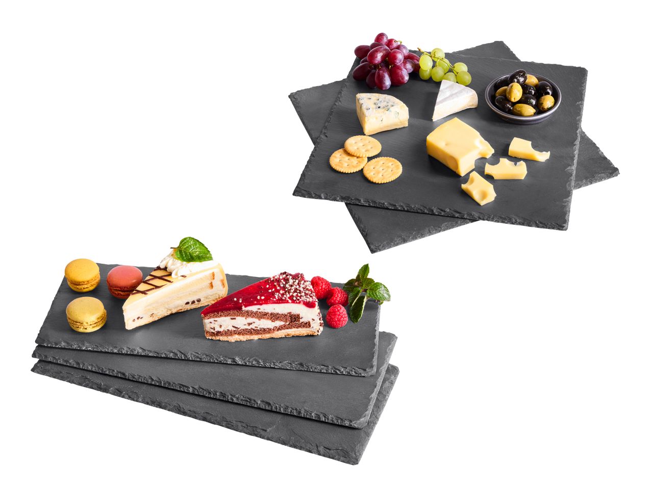 Käseplatte mit Trauben und Oliven sowie Kuchen und Macarons auf Schieferplatten.