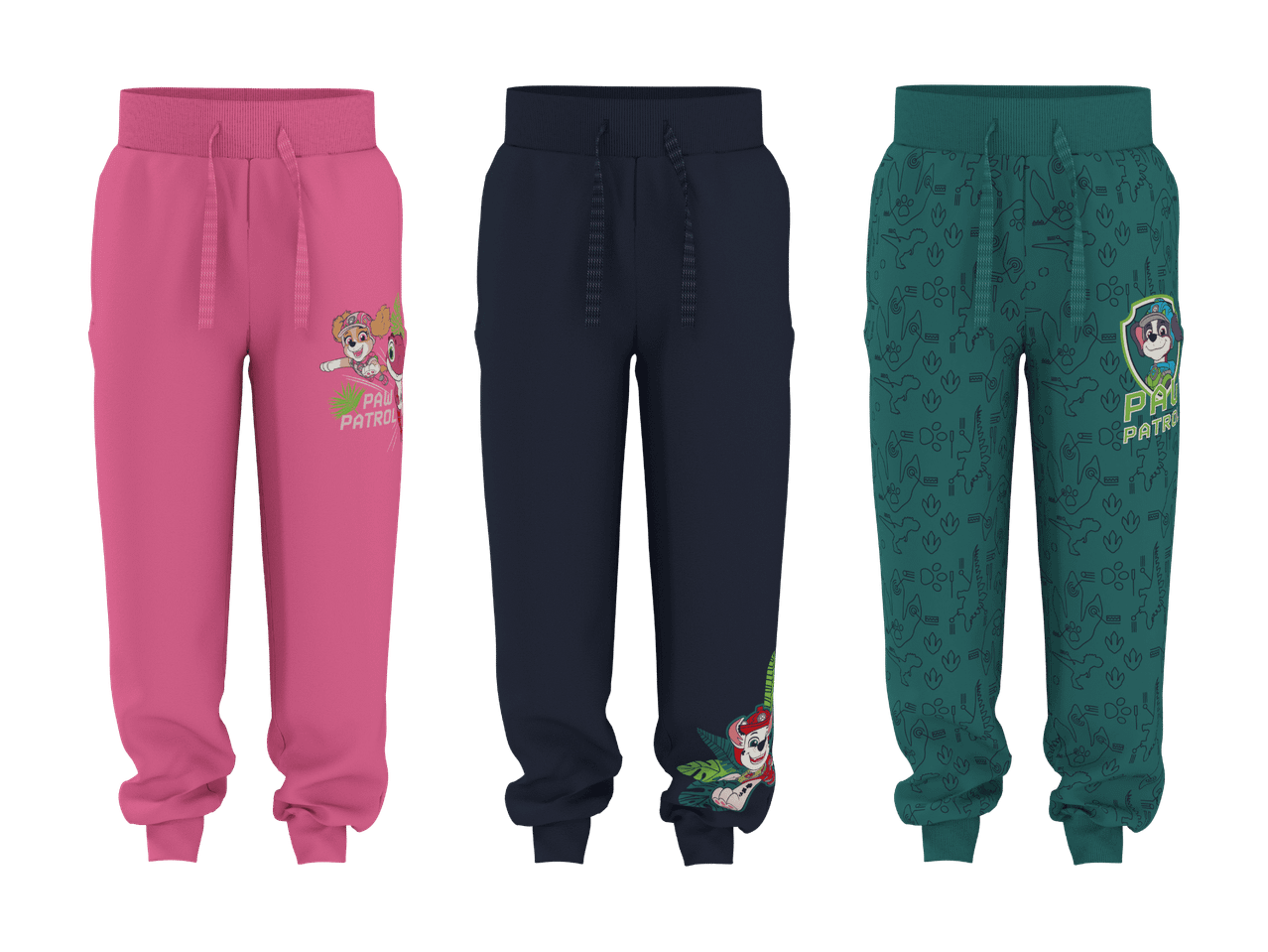 Tre par joggingbukser til børn: pink med en pigehund, mørkeblå med en drengedinosaur og grønne med dinosaurmønster og en drengedinosaur.