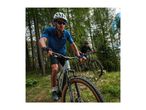 Two men mountain biking on a forest trail, wearing helmets and sportswear.