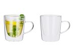 Two double-walled glass mugs, one with lemon and mint tea, one empty.