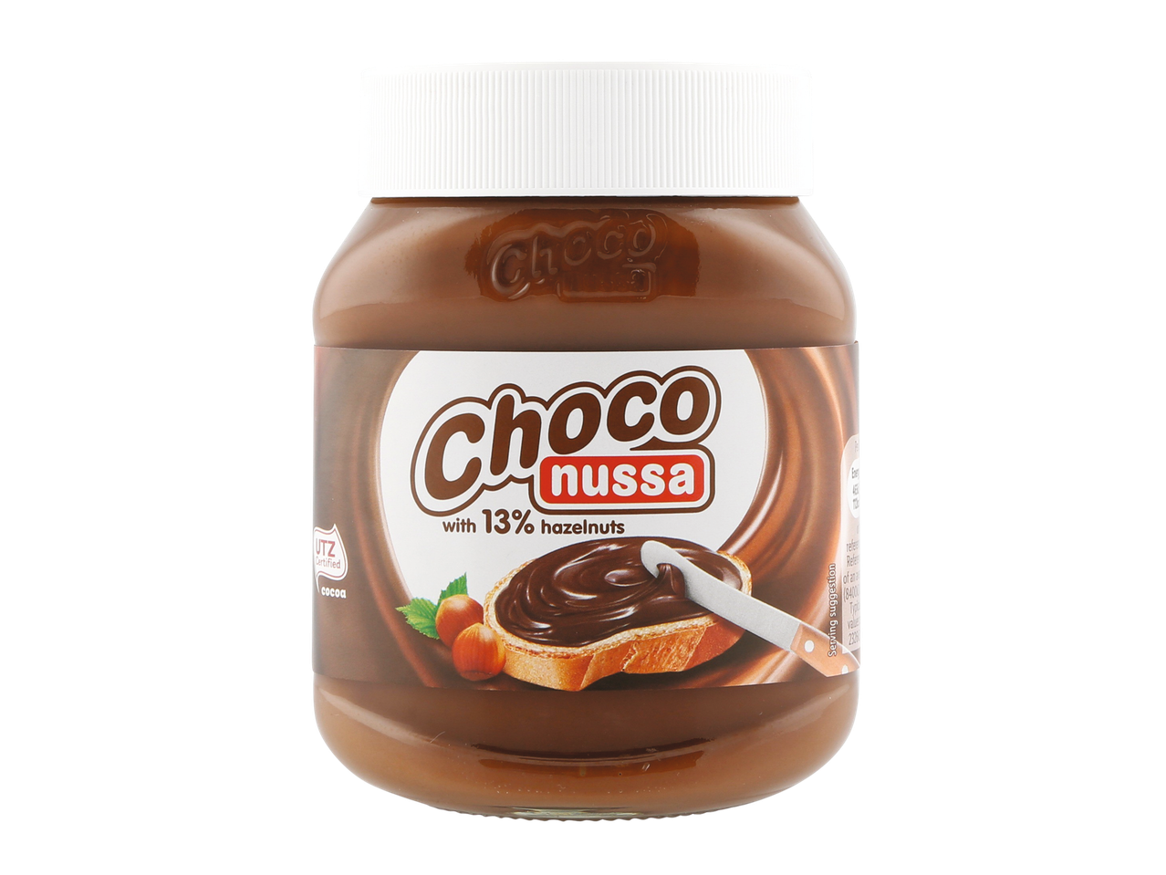 A jar of chocolate hazelnut spread with a label showing spread on toast and hazelnuts.