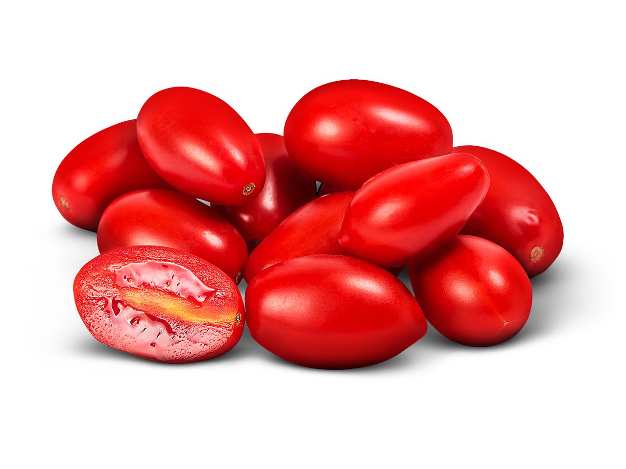 Pile of fresh red cornelian cherries, with one cut in half.