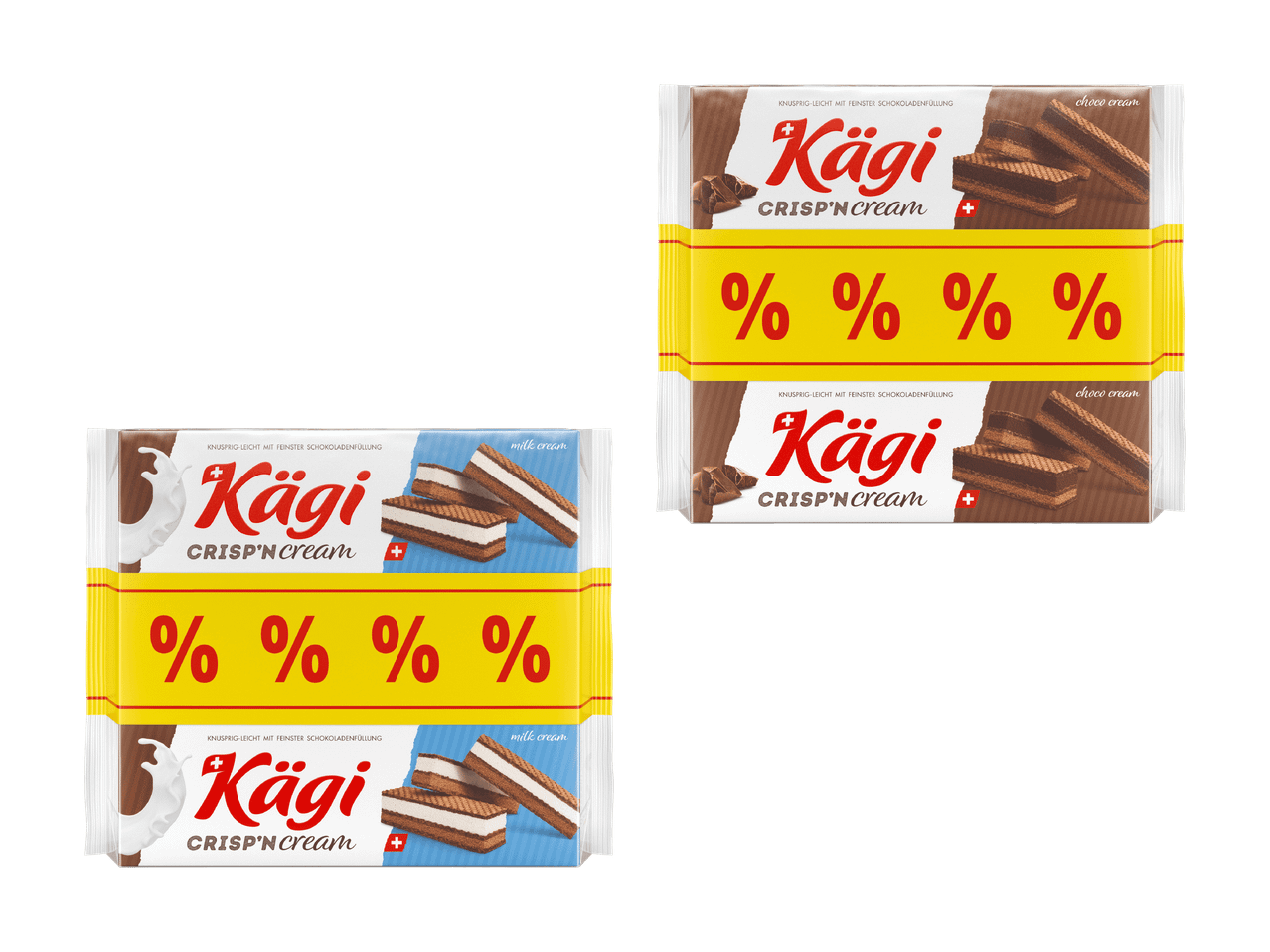 Vier Packungen Kägi Crisp'n Cream Waffeln, zwei mit Milchcreme und zwei mit Schokocreme.