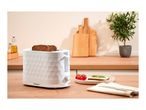 White textured toaster with bread slices on a wooden kitchen counter next to a prepared snack.