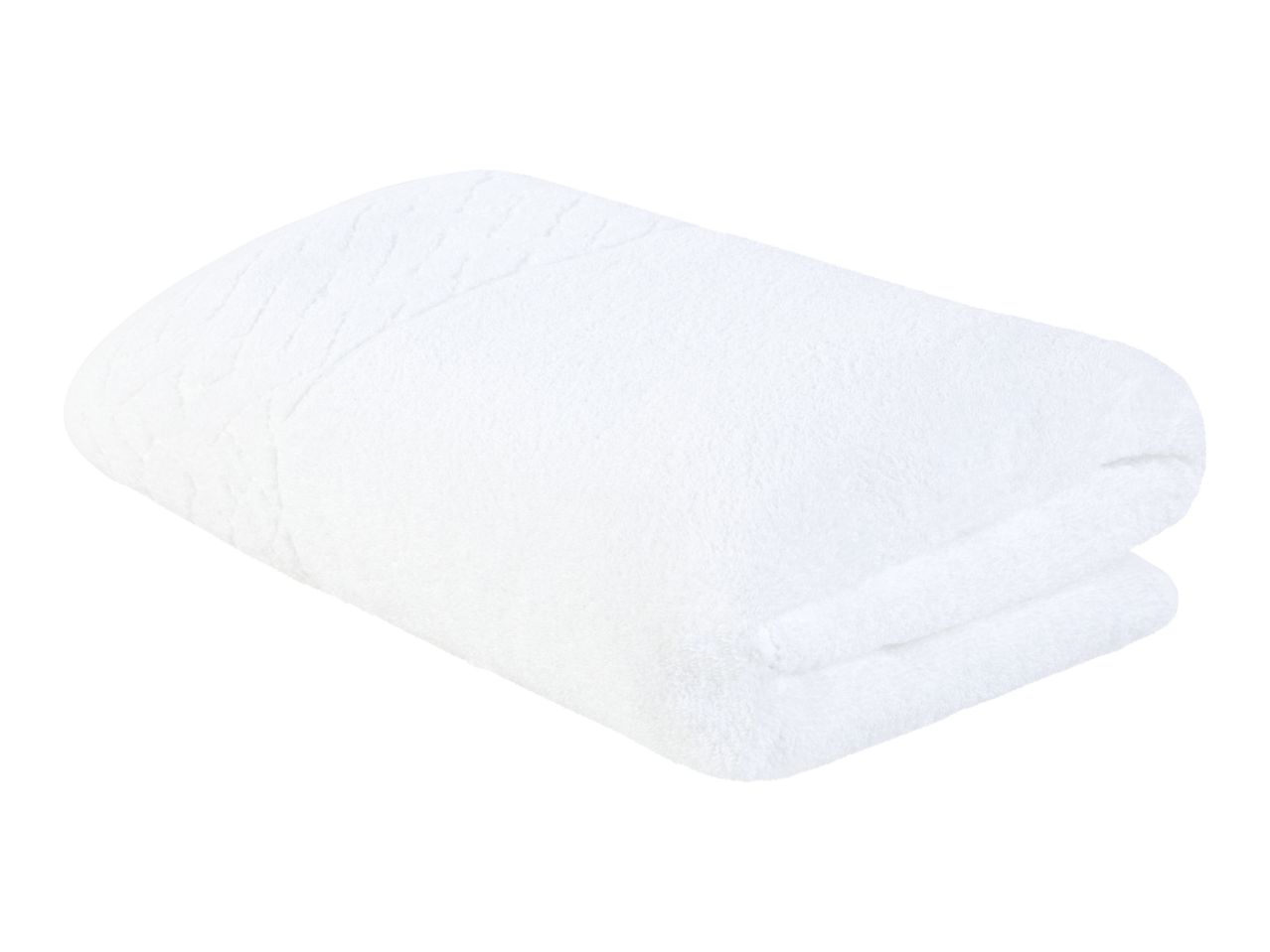 A folded white bath towel.