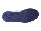 Shoe sole with white upper and dark blue bottom.