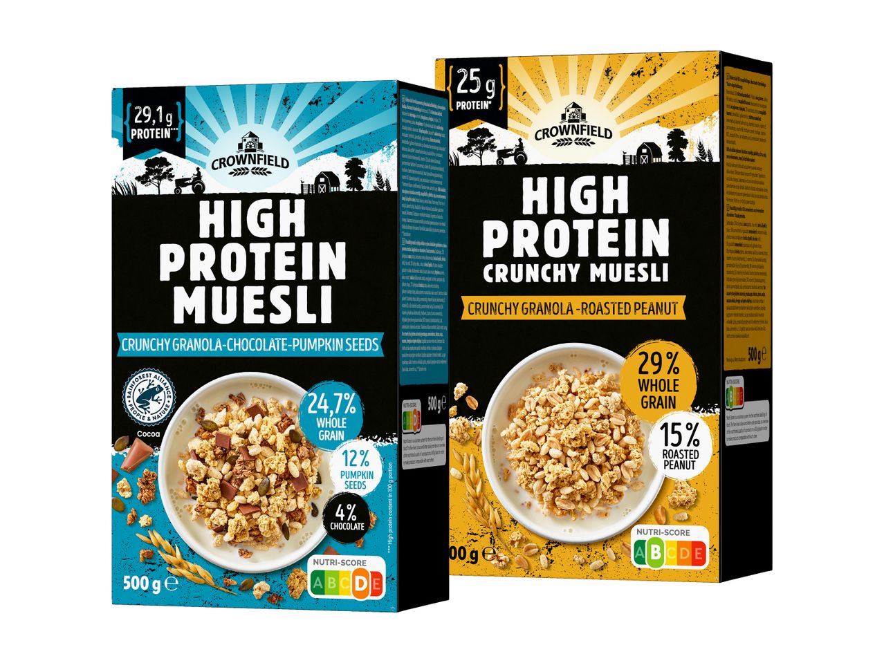 Dve škatli žitaric Crownfield High Protein Muesli, ena s čokolado in bučnimi semeni, druga z arašidi.