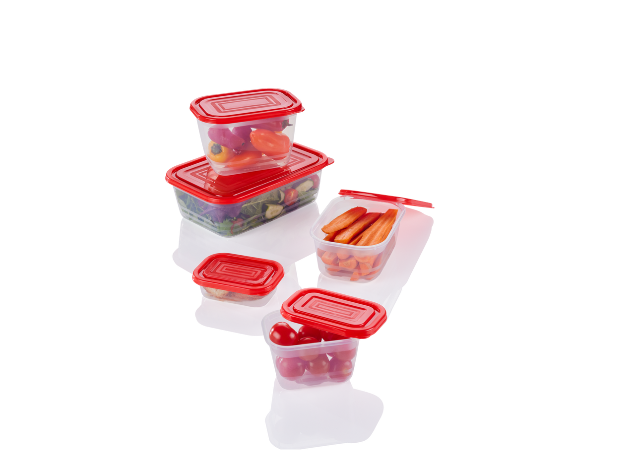 A set of red-lidded plastic food containers holding various vegetables.