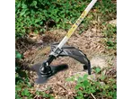 PARKSIDE® 4-in-1 Petrol Multi Tool trimming weeds and brambles in a garden.